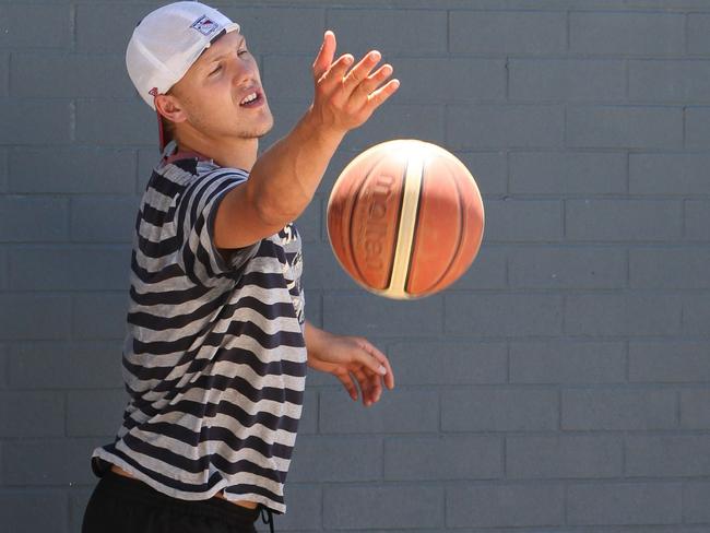 Forget the footy and beers, Nath just wants to play ball. Picture: Glenn Hampson