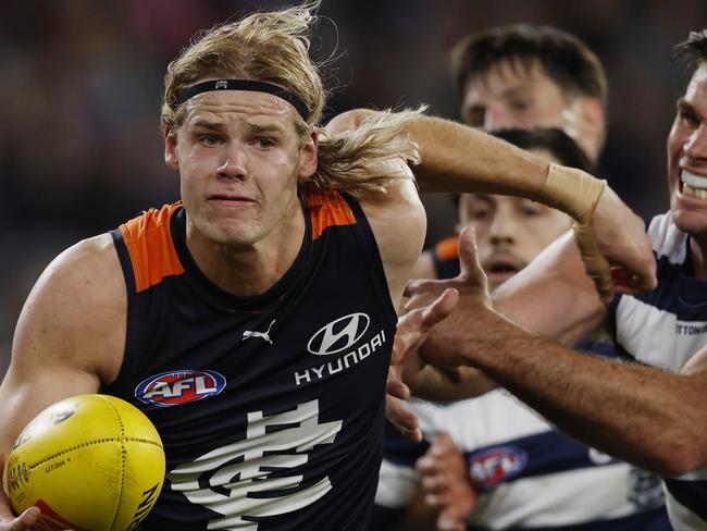 MELBOURNE, AUSTRALIAÃ June 21 , 2024.  AFL Round 15. Carlton vs Geelong at the MCG.   Tom De Koning of the Blues shrugs the Tom Hawkins of the Cats tackle   . Pic: Michael Klein