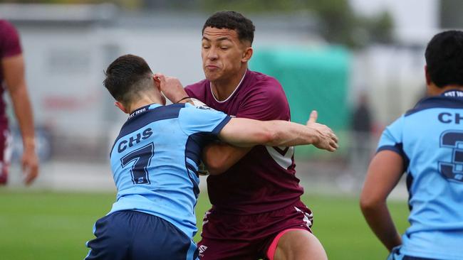 Action from the Australian state schools national rugby league championship match between Queensland Maroon and NSW CHS. Jared Horne attacks. Picture: Tertius Pickard