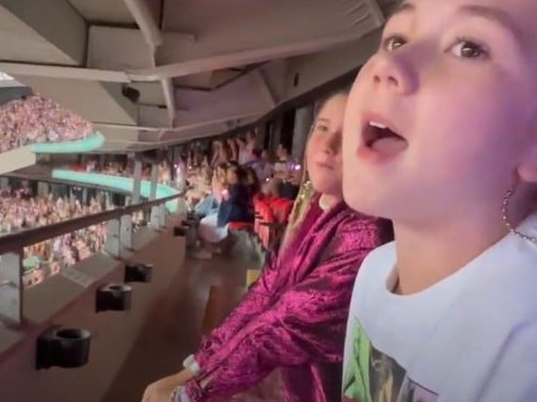 Laila Johnson, right, sings her heart out at the Taylor Swift concert at London's Wembley Stadium the day after being attacked and stabbed eight times in Leicester Square. Picture: Supplied