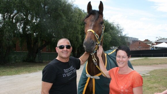 Bill Vlahos and his wife Joanne with one of their horses.