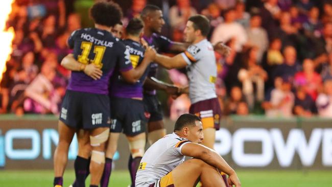 MELBOURNE, AUSTRALIA — SEPTEMBER 22: Broncos players look dejected as the Storm celebrate at the final whistle during the NRL Preliminary Final match between the Melbourne Storm and the Brisbane Broncos at AAMI Park on September 22, 2017 in Melbourne, Australia. (Photo by Scott Barbour/Getty Images)