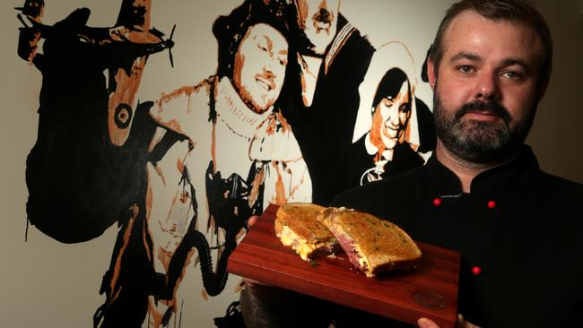 John McNeill with a reuben sandwich at Aussie Vets Coffee Co. Picture: Hamish Blair