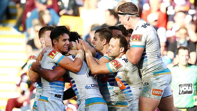 BRISBANE, AUSTRALIA - JUNE 09: The Titans celebrate a try during the round 13 NRL match between the Brisbane Broncos and the Gold Coast Titans at Suncorp Stadium on June 09, 2019 in Brisbane, Australia. (Photo by Jono Searle/Getty Images)