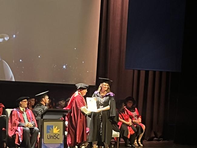 Graduates from the University of the Sunshine Coast's Fraser Coast campus celebrating at the Brolga Theatre.