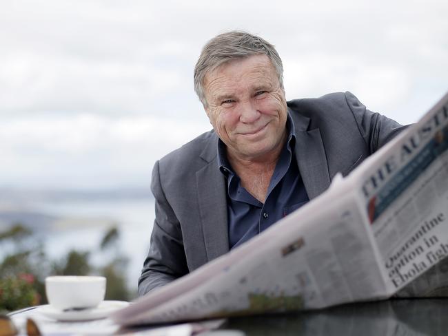 Published TasWeekend 01/11/2014 Page 9 Charles Wooley reading the paper at his local cafe, the Signal Station in Mt Nelson. TasWeekend. Charles Wooley cover story