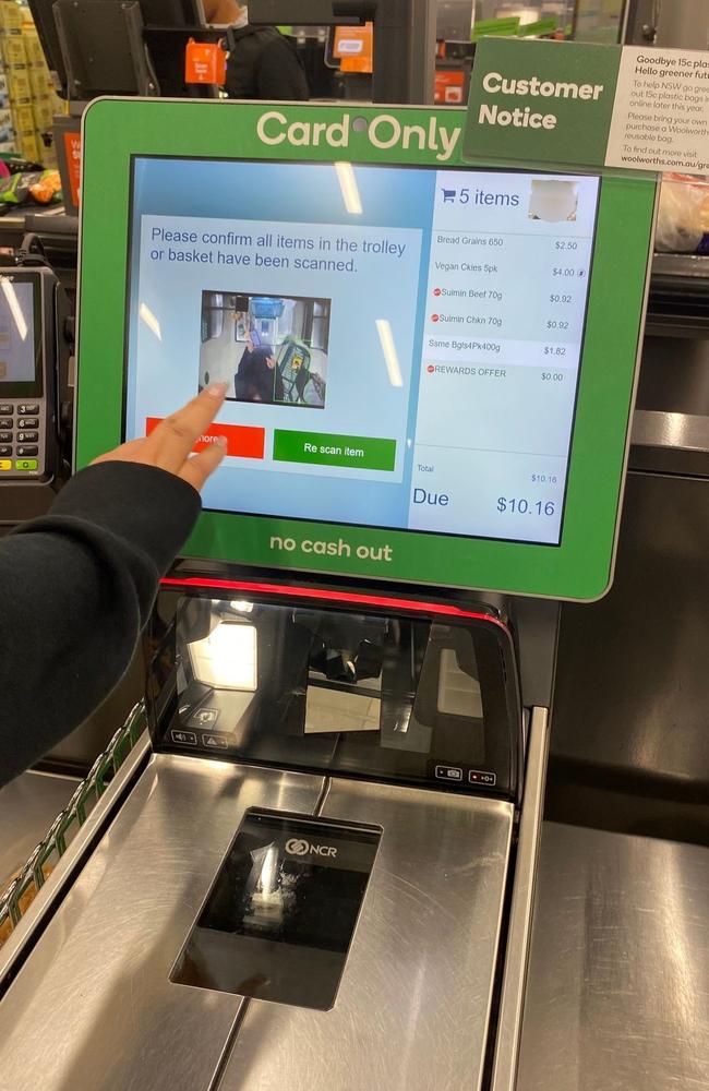 A staff member has to intervene if a Woolworths AI camera detects something in a shopper’s trolley while they’re trying to checkout.