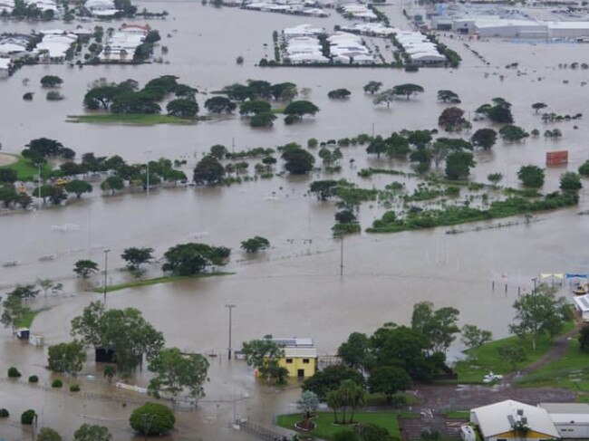 Hermit Park Tigers Football Club during the current floods in Townsville. Only the light poles surrounding the field and the yellow clubhouse can be seen. Picture taken from Facebook.