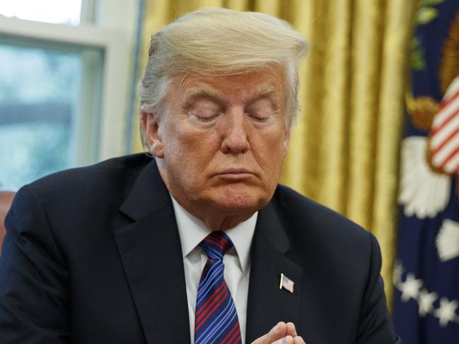 President Donald Trump listens during a phone call with Mexican President Enrique Pena Nieto about a trade agreement between the United States and Mexico, in the Oval Office of the White House, Monday, Aug. 27, 2018, in Washington. (AP Photo/Evan Vucci)