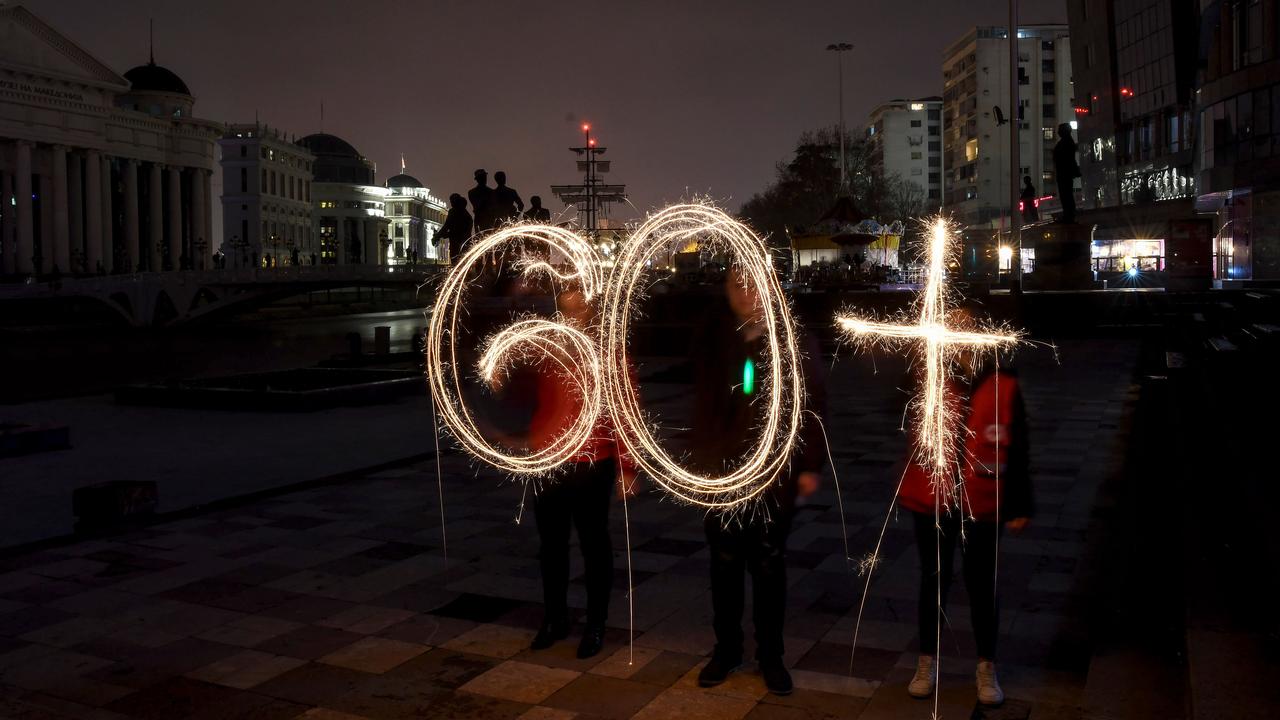 Sparkling sticks forming the number 60 during the Earth Hour event at Skopje main square, Macedonia on March 24, 2018. Turning off lights for 60 or more minutes is a symbolic action. Picture: AFP