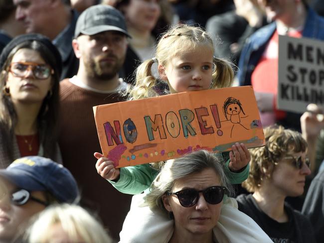 Thousands gather outside the State Library for the national rally against gender based violence. Picture: Andrew Henshaw