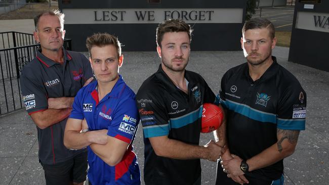 Mernda coach Paul Derrick and captain Anthony Bradford with Laurimar captain Mitch Thompson and coach Justin Sherman. Picture: George Salpigtidis