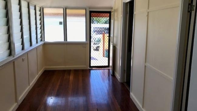 The home has timber floors and louvre windows. Picture: realestate.com.au