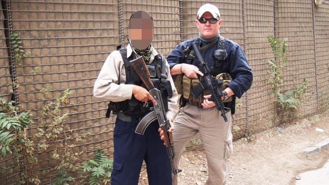 Australian Embassy in Kabul former head of security Paul Johnstone with a locally contracted guard who is now trying to get into Kabul airport for evacuation while awaiting visa approval to travel to Australia on humanitarian grounds. Picture: Supplied