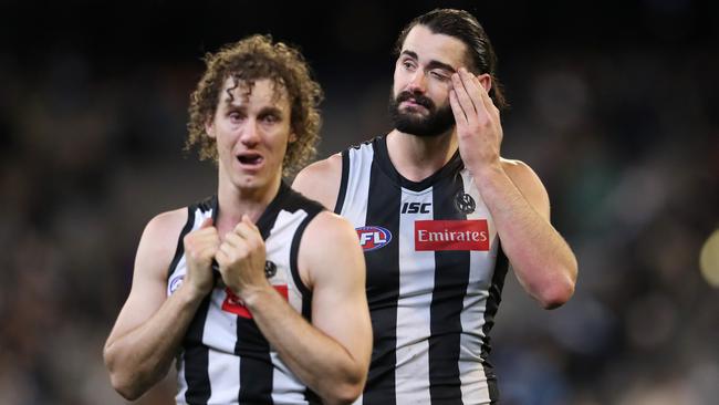 Chris Mayne and Brodie Grundy react to a heartbreaking loss to GWS in the preliminary final. Picture: Michael Klein.