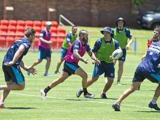 WORKING HARD: Gold Coast Titans player Nathan Peats fires off a pass during an open training session at Clive Berghofer Stadium in December. The Titans and Brisbane Broncos will play a trial game in Toowooomba this weekend. Picture: Kevin Farmer