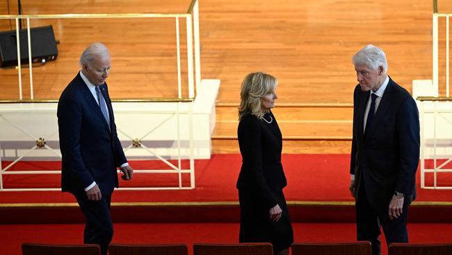 Joe and Jill Biden with Bill Clinton before the service. Picture: AFP