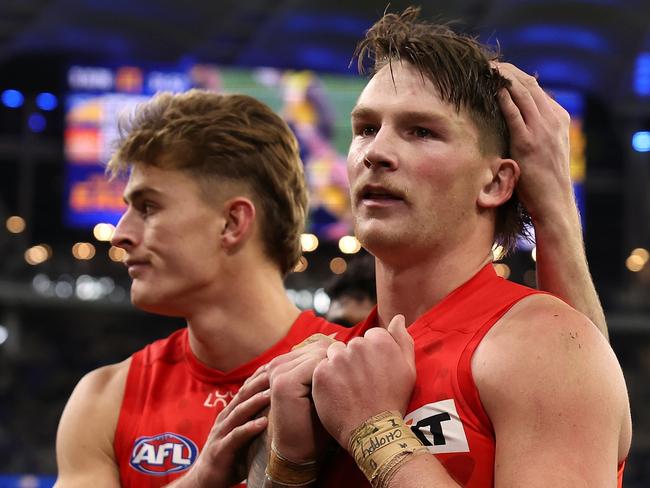 PERTH, AUSTRALIA - AUGUST 02: Will Graham and Bailey Humphrey of the Suns walk from the ground after being defeated during the round 21 AFL match between West Coast Eagles and Gold Coast Suns at Optus Stadium, on August 02, 2024, in Perth, Australia. (Photo by Paul Kane/Getty Images)