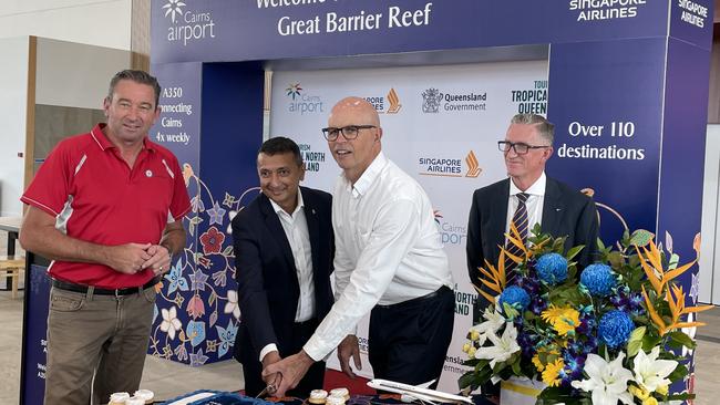 Cairns Airport CEO Richard Barker and Singapore Airlines regional vice president Louis Arul cut a cake to celebrate the launch of Singapore Airlines A350 Service. (Left) Barron River MP Craig Crawford and (right) TTNQ Deputy Chair Wayne Reynolds. Picture: Dylan Nicholson