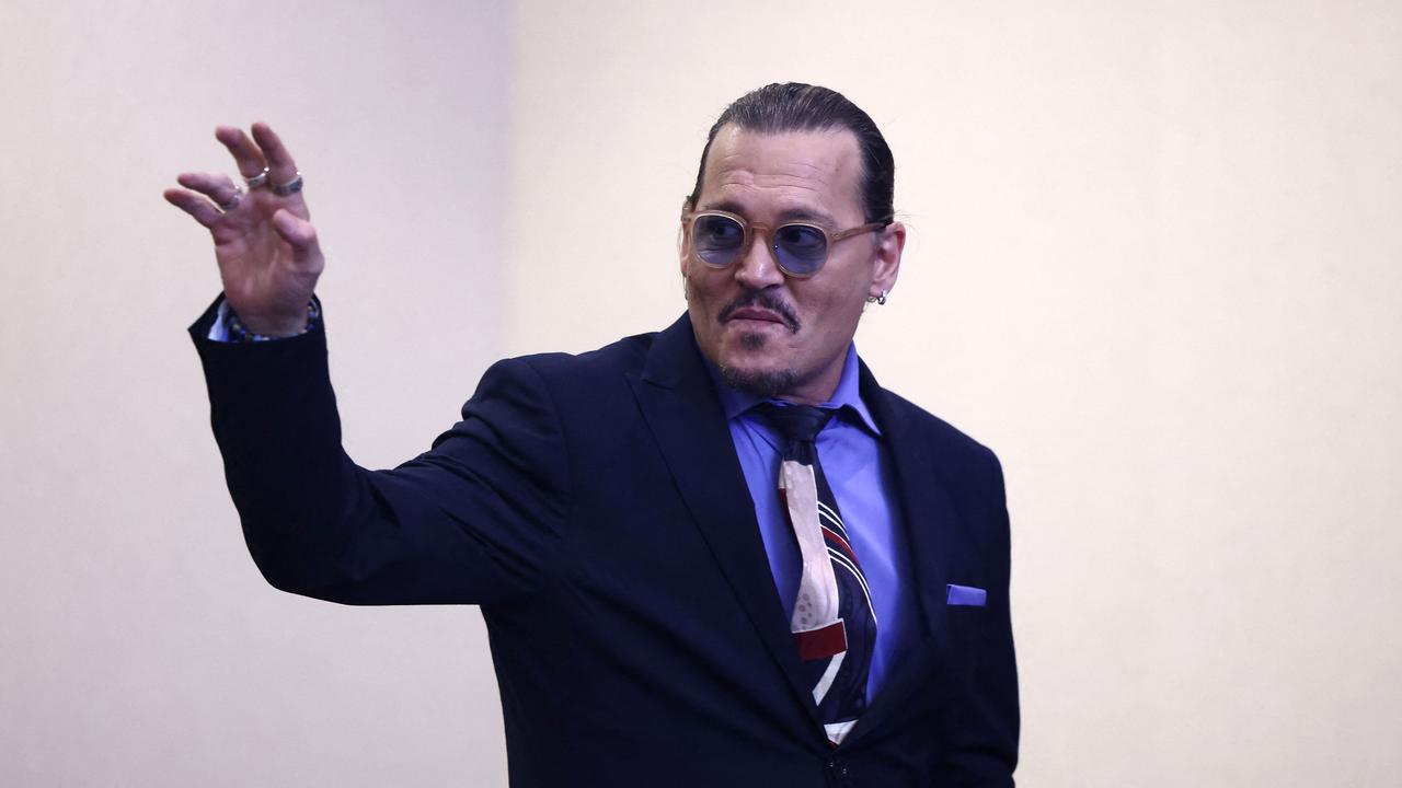 Actor Johnny Depp waves as he departs at the end of the day of a defamation trial at the Fairfax County Circuit Courthouse, Virginia, on May 5, 2022. Picture: Jim Lo Scalzo/AFP