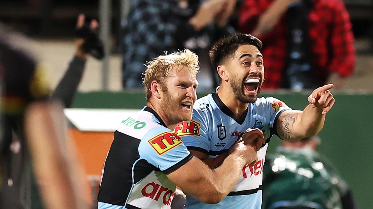 SYDNEY, AUSTRALIA – JUNE 11: Shaun Johnson of the Sharks celebrates with his teammates after scoring a try during the round 14 NRL match between the Cronulla Sharks and the Penrith Panthers at Netstrata Jubilee Stadium, on June 11, 2021, in Sydney, Australia. (Photo by Mark Kolbe/Getty Images)