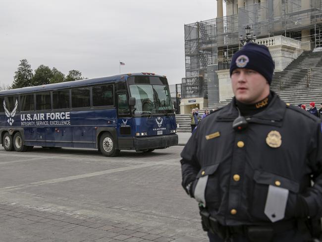 An Air Force bus waits arrives on the plaza of the Capitol to pick up a congressional delegation as President Donald Trump used his executive power to deny military aircraft to House Speaker Nancy Pelosi to visit troops abroad, on Capitol Hill in Washington, Thursday, Jan. 17, 2019. (AP Photo/J. Scott Applewhite)