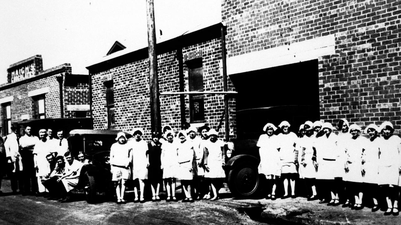 Employees outside the Haigh's Chocolate factory in Parkside, South Australia circa 1928. Alfred Haigh is pictured on the far left.