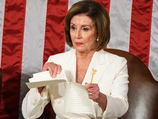 Speaker of the US House of Representatives Nancy Pelosi rips a copy of US President Donald Trumps speech after he delivers the State of the Union address at the US Capitol in Washington, DC, on February 4, 2020. (Photo by MANDEL NGAN / AFP)