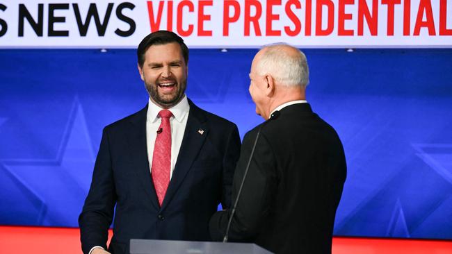 Senator and Republican vice presidential candidate J.D. Vance and Minnesota Governor and Democratic vice presidential candidate Tim Walz talk with each other at the end of the Vice Presidential debate. Picture: Angela Weiss/AFP