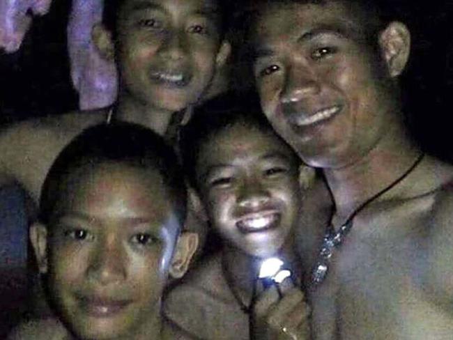 A picture of four of the twelve missing boys near the Tham Luang cave at the Khun Nam Nang Non Forest Park in Mae Sai on July 2, 2018.