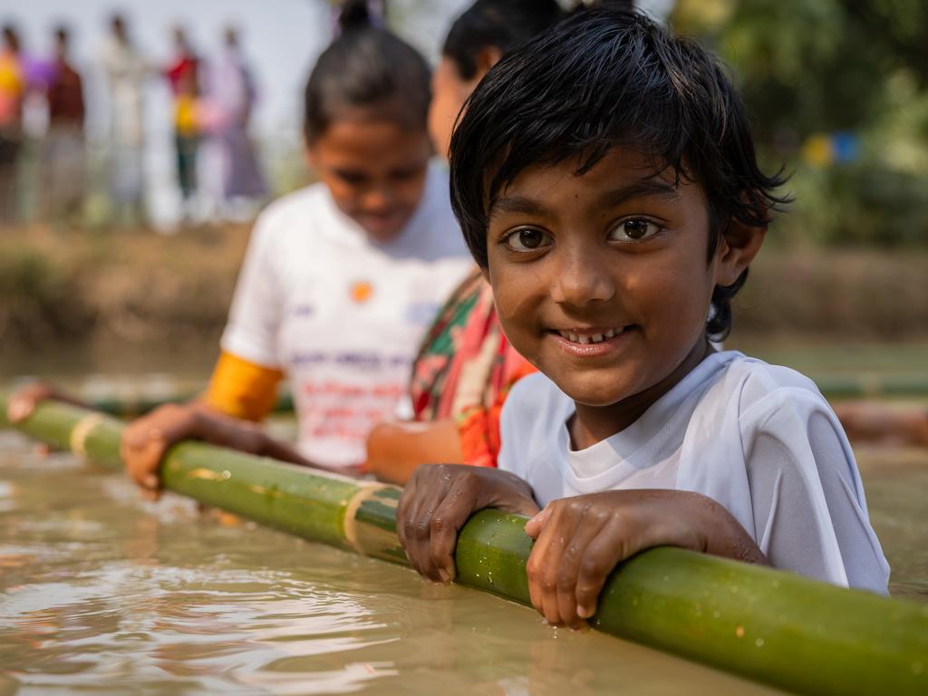 Takiya, 6 learns to swim with Olympian Emma McKeon, a UNICEF Australia ambassador, at one the charity's SwimSafe programs in Sreepur, Gazipur Union, Gazipur, Bangladesh. Picture: Jason Edwards