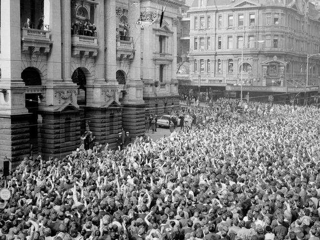 Fans unite . the massive crowd outside Melbourne Town Hall when The Beatles arrived for their State reception.