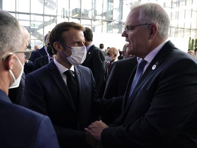 Australian Prime Minister Scott Morrison attends the G20 Official Welcome and Family photo and chats with French President Emmanuel Macron in Rome on Saturday, October 30, 2021. Picture: Adam Taylor