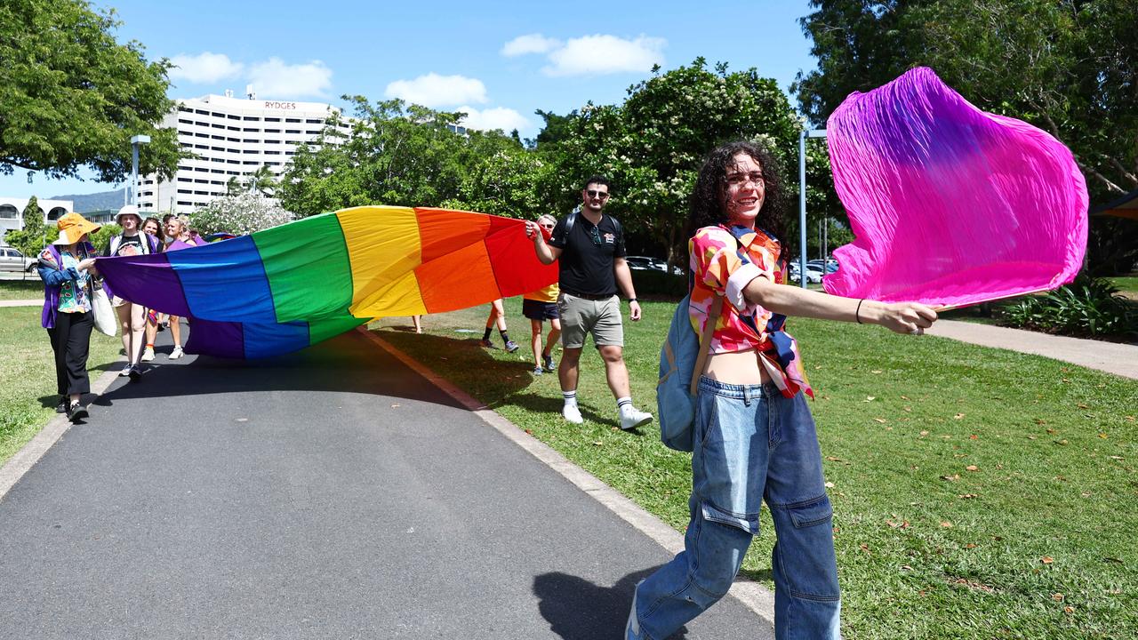 A small group of LGBTIQ people and supporters paraded along the Cairns Esplanade with a huge rainbow flag for the Pride Stride, part of the Cairns Pride Festival. Baylee O'Grady led the march as it made its way past Muddy's Playground. Picture: Brendan Radke