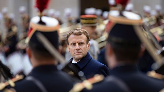 Emmanuel Macron review troops in the courtyard of the Invalides in Paris. Picture: AFP