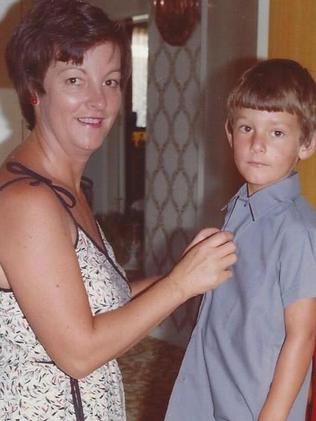 A young Mark Webber gets help with his school uniform in a photo from his book Aussie Grit.  Picture:  Supplied