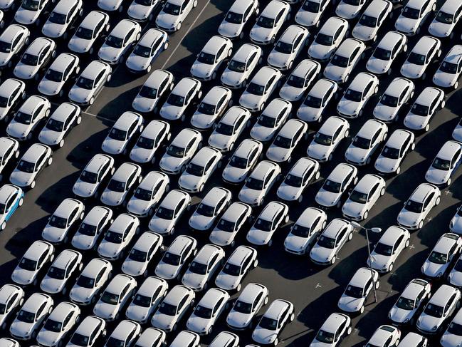 TOPSHOTS New Porsche cars are parked at the grounds of the Porsche plant in Leipzig, eastern Germany, on November 3, 2015. The US Environmental Protection Agency said late Monday, November 2, 2015, it had discovered that various six-cylinder 3.0 litre diesel VW Touareg, Porsche Cayenne and Audis were also rigged with a software which skews the results of pollution tests. AFP PHOTO / DPA / JAN WOITAS +++ GERMANY OUT +++