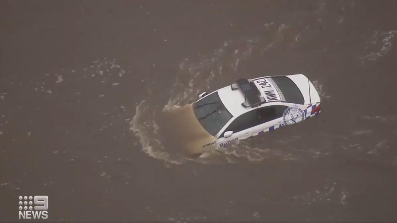 A police car becomes trapped in the Nepean River. Picture: 9 News via Twitter