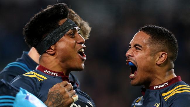 Malakai Fekitoa of the Highlanders celebrates his try with Aaron Smith.