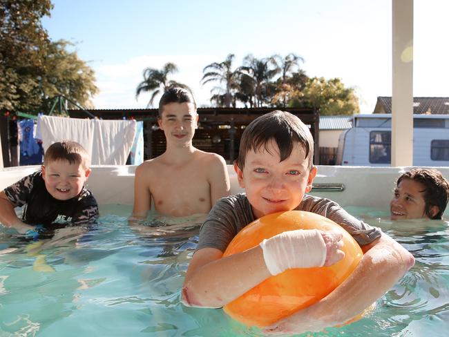 Billy O'Brien at his Warilla home with younger brother Zac and mates Kyle Pendergast and Matty Walker. Picture: Sam Ruttyn