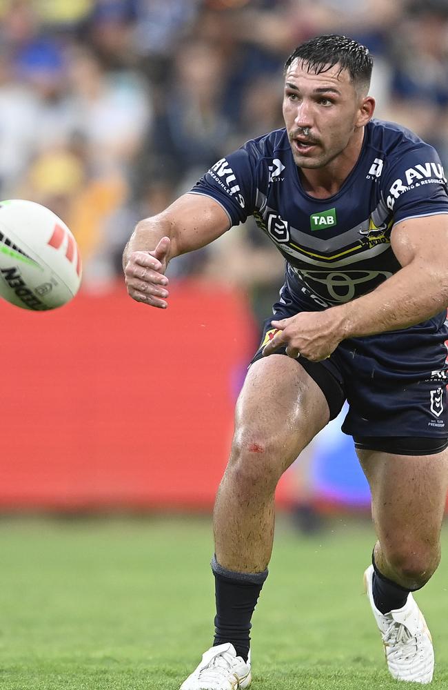 Reece Robson of the Cowboys passes the ball during the round one NRL match between the North Queensland Cowboys and the Canberra Raiders at Qld Country Bank Stadium on March 04, 2023 in Townsville, Australia. (Photo by Ian Hitchcock/Getty Images)