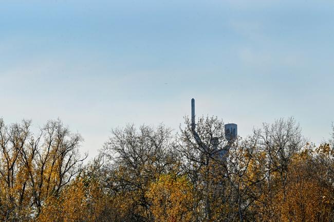 This photograph taken on November 3, 2023, shows the Motherland Monument, a 62-meter Soviet-era statue, through the trees in Kyiv.