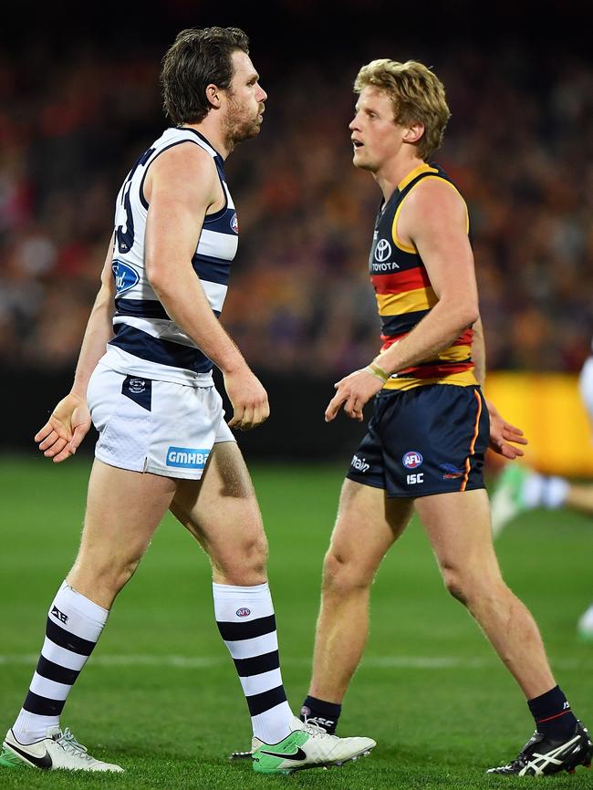 Patrick Dangerfield and Rory Sloane of the Crows meet during the round 18 match. Picture: Daniel Kalisz/Getty