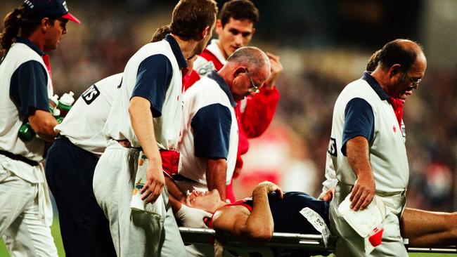 Shaun Smith is stretchered off during the 1997 round 3 AFL match between Melbourne and Sydney.