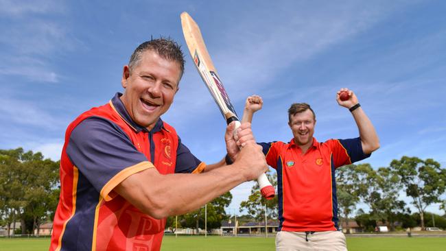 Flinders Park Cricket Club president Graham Crawford and vice-captain Matt Overall celebrate after the club won the A2 Turf Cricket title. Picture: AAP/Brenton Edwards