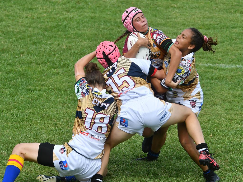 Under 17 Country player Mersades Lawson is hit in a City tackle. Picture: Tony Martin