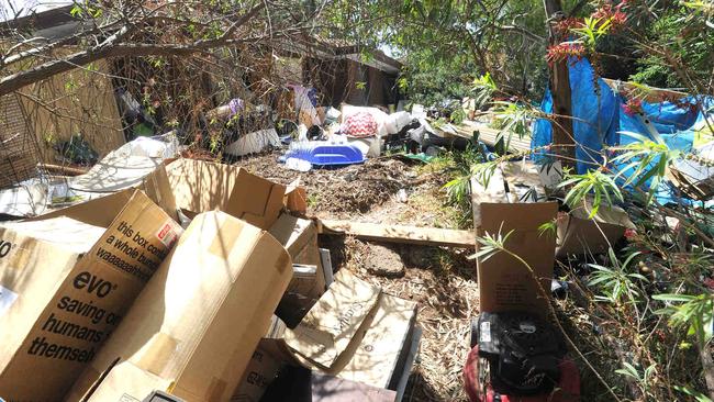 The house at Aberfoyle Park where rubbish is strewn across the front and back yards. Picture: Michael Milnes