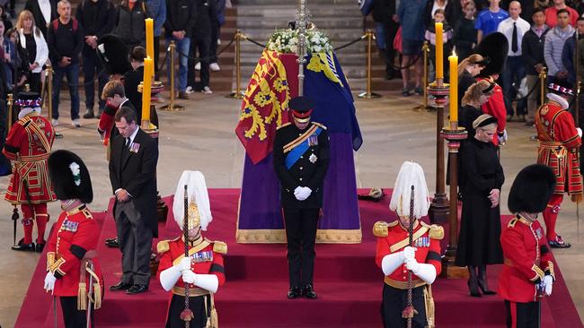 The Queen’s eight grandchildren stand guard over her coffin. Picture: AFP