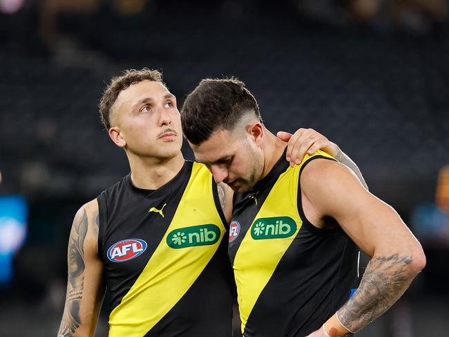 MELBOURNE, AUSTRALIA - AUG 11: Shai Bolton and Jack Graham of the Tigers look dejected after a loss during the 2024 AFL Round 22 match between the Richmond Tigers and the St Kilda Saints at Marvel Stadium on August 11, 2024 in Melbourne, Australia. (Photo by Dylan Burns/AFL Photos via Getty Images)