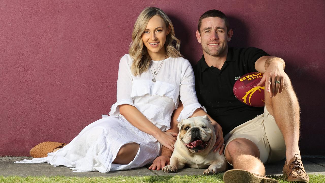 Andrew McCullough and wife Carlie McCullough with their bulldog Daisy. Picture: Annette Dew